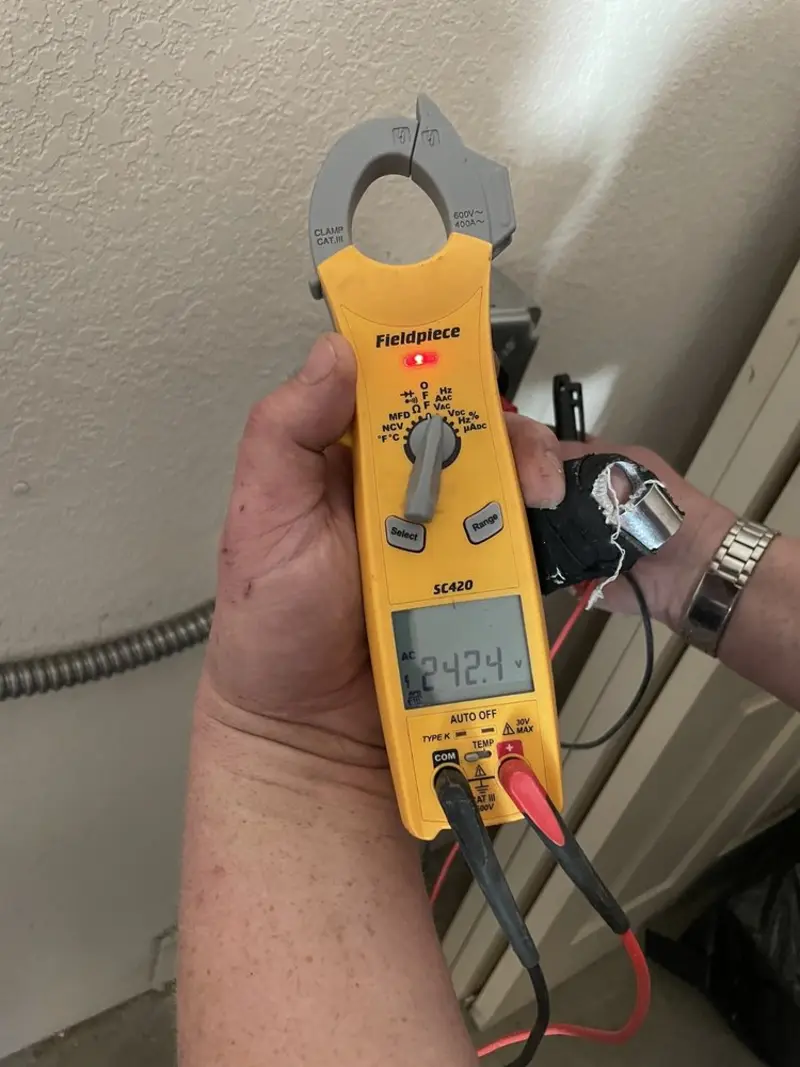 Voltage testing with clamp meter during Electrical Installation Services in North Brunswick